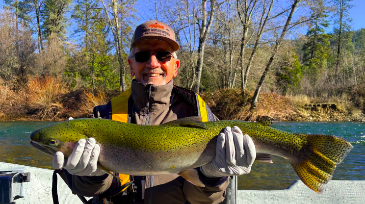 PHW Veteran Dan Johnson with a beautiful Trinity River Steelhead … the smile says it all!